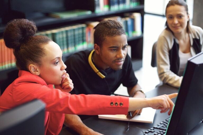 Educators looking at a screen