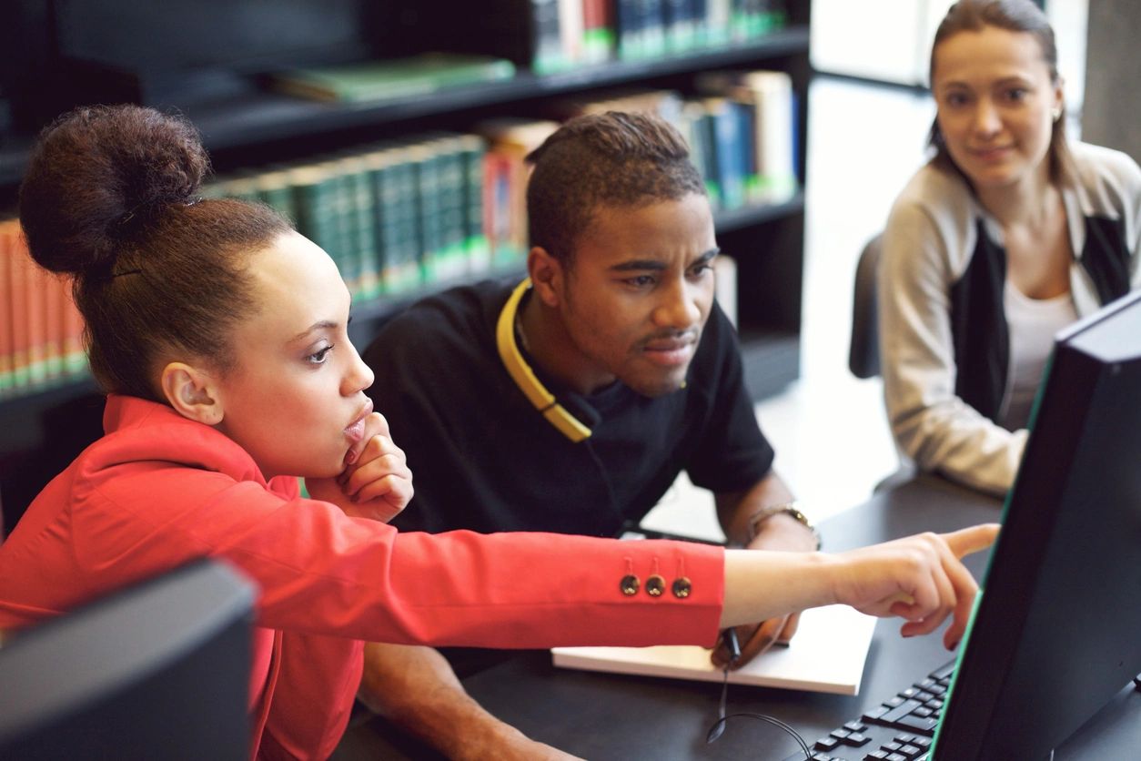 Educators looking at a screen